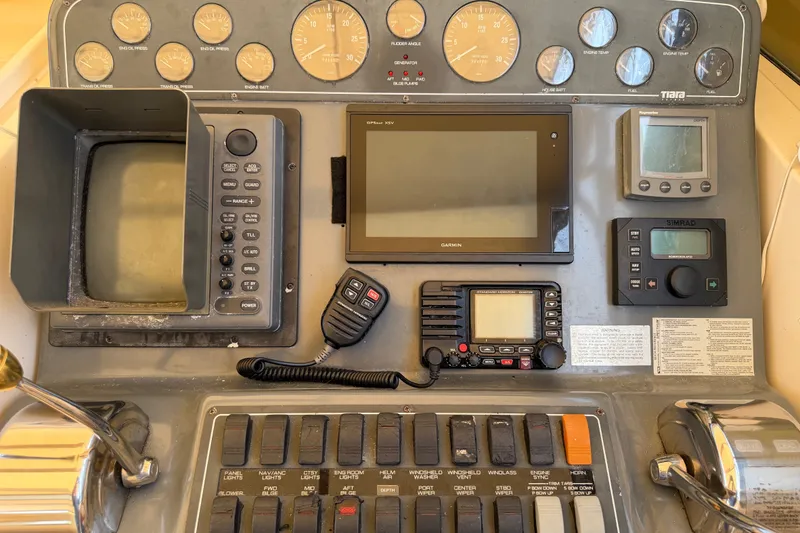 Slide: The Image of Control panel of a 2001 Tiara 35 Express boat with navigation instruments. - 10