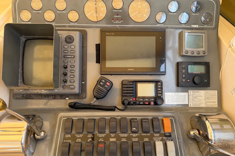 Slide: The Image of Control panel of a 2001 Tiara 35 Express boat with navigation instruments. - 5
