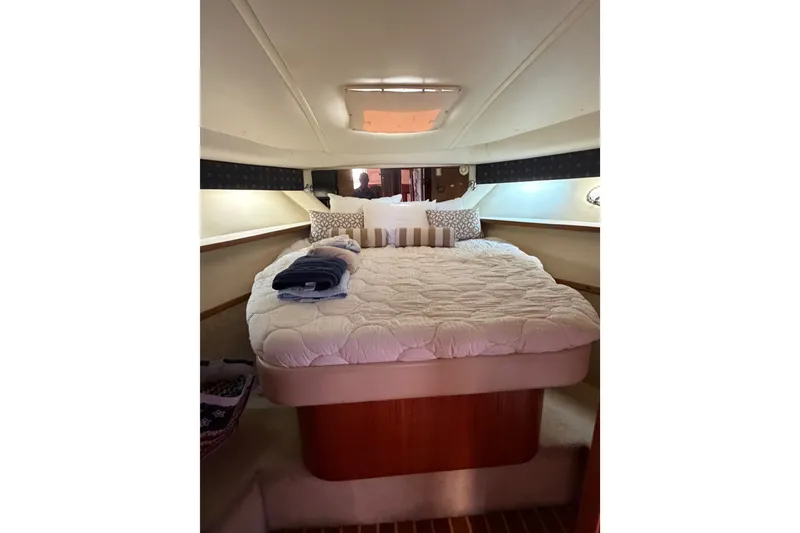 Slide: The Image of Luxurious cabin interior of 2001 Tiara 35 Express yacht with cozy bedding. - 18