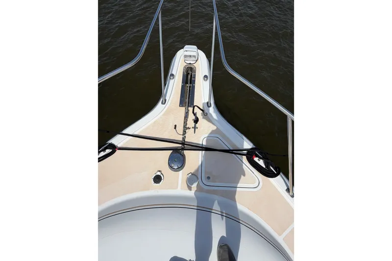 Slide: The Image of Bow view of a 2001 Tiara 35 Express boat on water. - 8