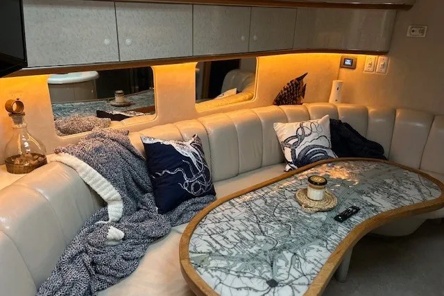 Slide: The Image of Luxurious interior of a 1996 Sea Ray 450 Sundancer yacht with elegant seating and decor. - 14