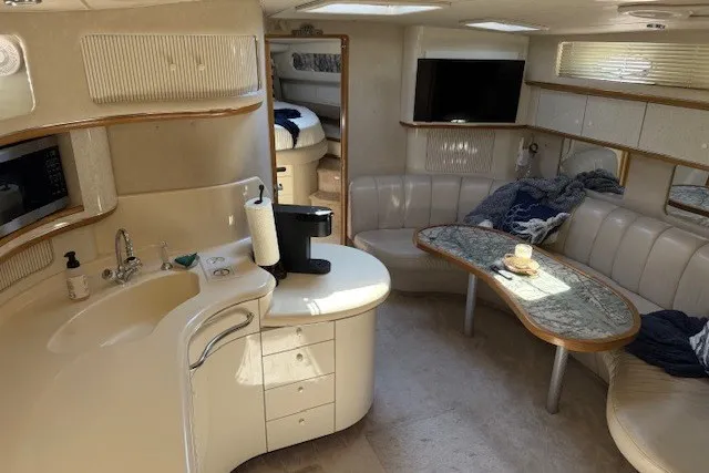 Slide: The Image of Luxurious interior of a 1996 Sea Ray 450 Sundancer yacht with modern amenities. - 24
