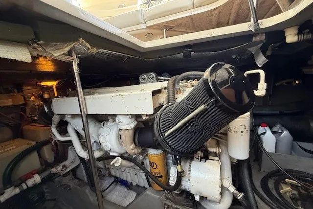 Slide: The Image of Engine compartment of a 1996 Sea Ray 450 Sundancer boat, showcasing mechanical components. - 46