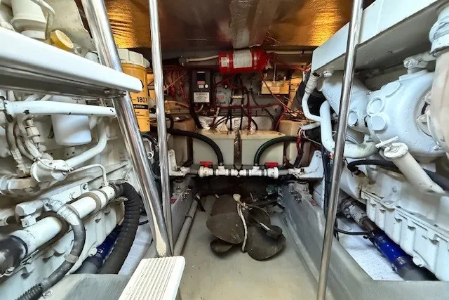 Slide: The Image of Engine room of a 1996 Sea Ray 450 Sundancer, showcasing mechanical components and equipment. - 44