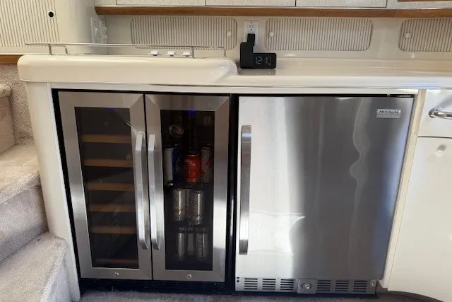 Slide: The Image of Built-in wine cooler and fridge in 1996 Sea Ray 450 Sundancer yacht interior. - 29