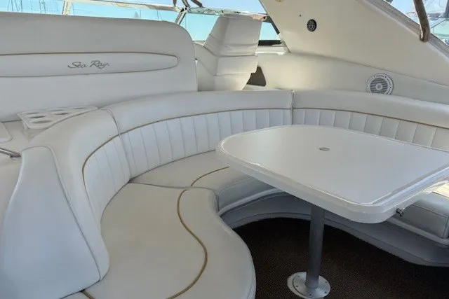 Slide: The Image of Luxurious white seating area on a 1996 Sea Ray 450 Sundancer yacht. - 15