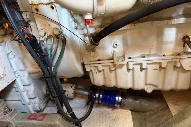 Slide: The Image of Engine compartment of a 1996 Sea Ray 450 Sundancer boat, showing mechanical components and wiring. - 50