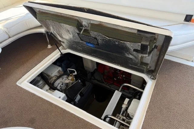 Slide: The Image of Engine compartment of a 1996 Sea Ray 450 Sundancer yacht, showcasing mechanical components. - 42