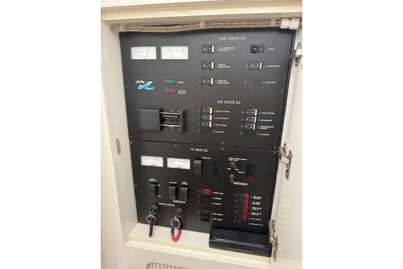Slide: The Image of Electrical control panel of a 1996 Sea Ray 450 Sundancer boat. - 41