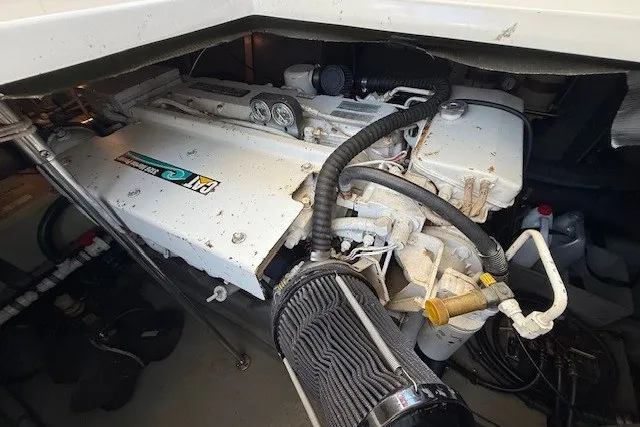 Slide: The Image of Engine compartment of a 1996 Sea Ray 450 Sundancer boat, showcasing mechanical components. - 47
