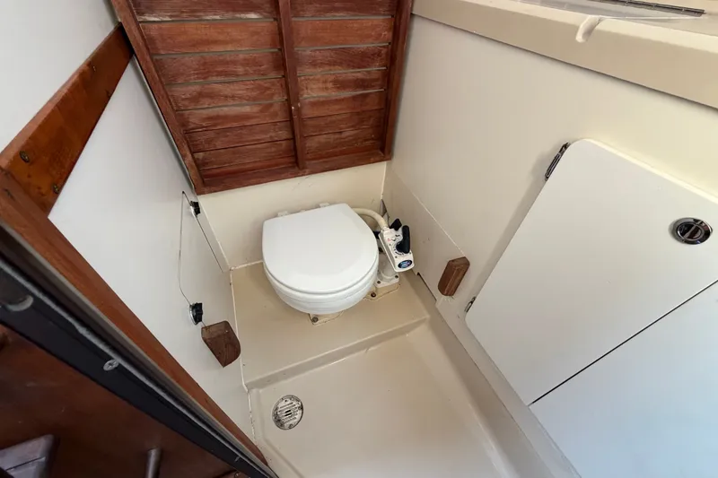 Slide: The Image of Compact marine toilet in 1989 Hunter 30 sailboat bathroom. - 25