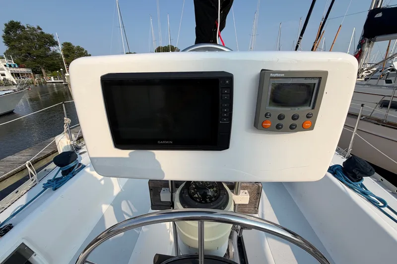 Slide: The Image of Cockpit of 1989 Hunter 30 sailboat with Garmin and Raytheon navigation equipment. - 7