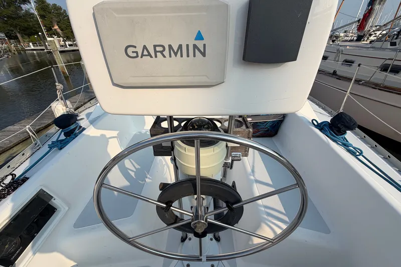 Slide: The Image of Steering wheel of a 1989 Hunter 30 sailboat with Garmin navigation system. - 6