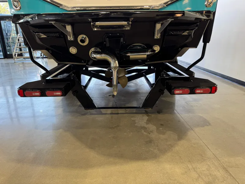Slide: The Image of The image shows the rear of a 2024 Nautique Super Air Nautique G23 with a propeller and lights. - 8