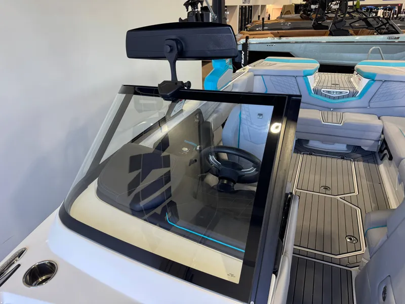 Slide: The Image of The image shows the cockpit of a 2024 Super Air Nautique G23 with modern seating and a sleek steering wheel. - 21