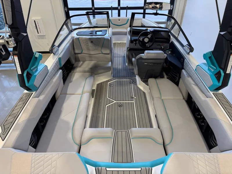 Slide: The Image of The image shows the interior of a 2024 Super Air Nautique G23 with modern seating and a sleek helm. - 14