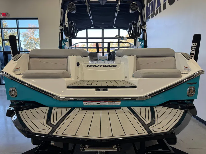Slide: The Image of The image shows the rear of a 2024 Nautique Super Air Nautique G23 with stylish design. - 9