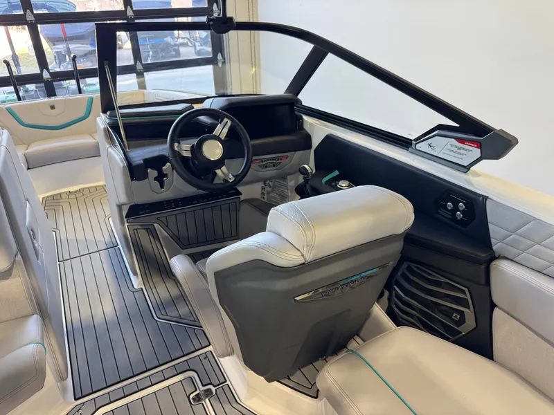 Slide: The Image of The image shows the cockpit of a 2024 Super Air Nautique G23 with modern seating and a sleek dashboard. - 25