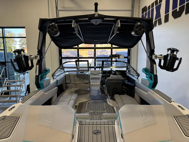 Slide: The Image of The image shows the interior of a 2024 Super Air Nautique G23 with modern seating and speakers. - 10