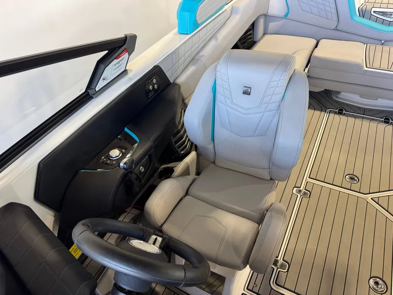 Slide: The Image of The image shows the cockpit of a 2024 Super Air Nautique G23 with gray seats and modern design. - 22