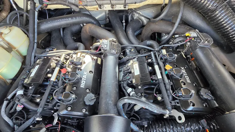 Slide: The Image of Engine compartment of a 2019 Scarab 255 ID Wake Edition with dual Rotax engines. - 21