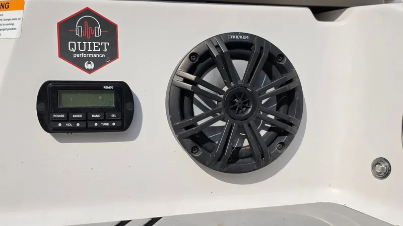 Slide: The Image of Close-up of a speaker and control panel on a 2019 Scarab 255 ID Wake Edition boat. - 23