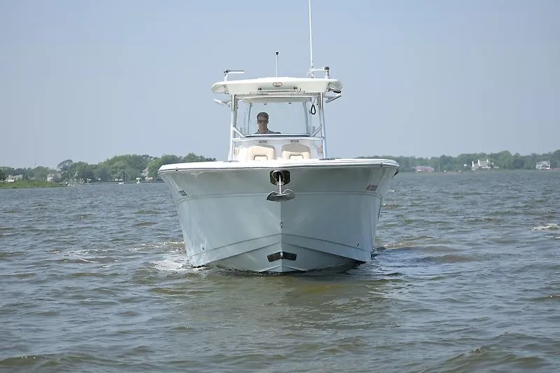 Slide: The Image of A 2018 Sea Fox 328 Commander cruising on calm waters under a clear sky. - 6