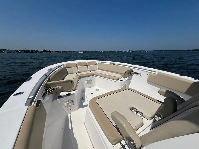 Slide: The Image of The image shows the bow of a 2018 Sea Fox 328 Commander with beige seating. - 18