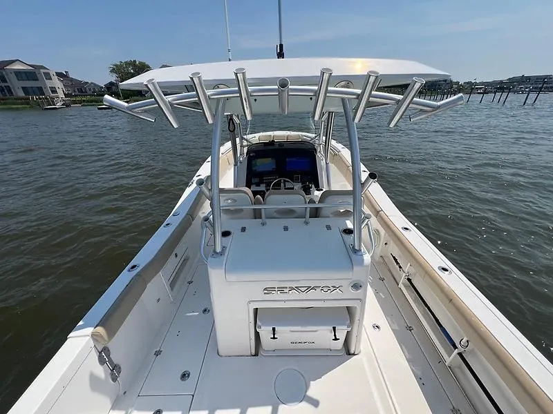 Slide: The Image of A 2018 Sea Fox 328 Commander with a spacious deck and sturdy T-top on the water. - 10