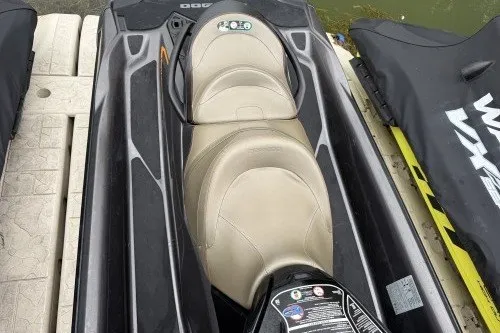 Slide: The Image of 2021 Sea-Doo GTX jet ski with beige seats, docked on a platform. - 3