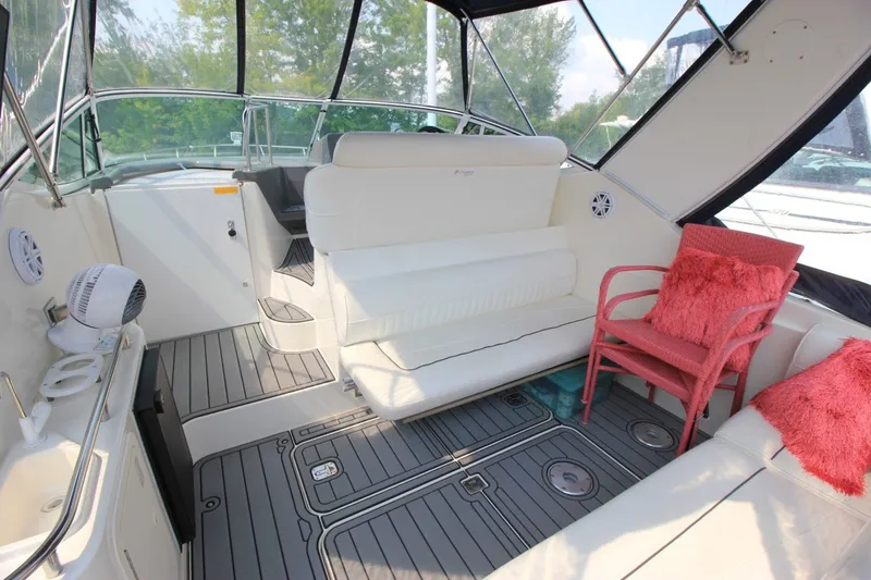 Slide: The Image of Interior of 2006 Cruisers Yachts 320 Express with white seating and pink accents. - 4