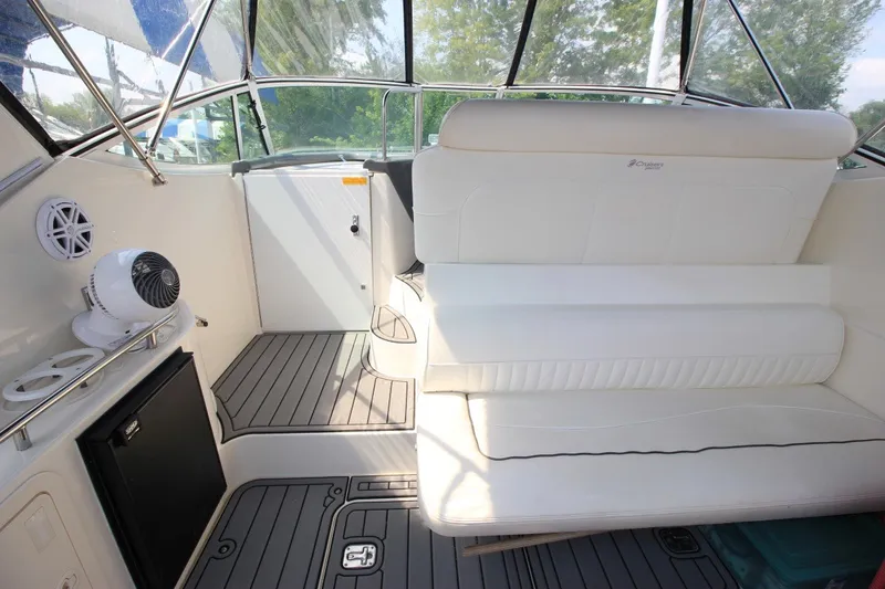 Slide: The Image of 2006 Cruisers Yachts 320 Express interior with white seating and modern amenities. - 8