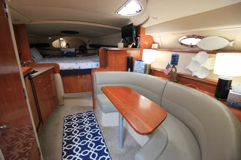 Slide: The Image of Luxurious interior of 2006 Cruisers Yachts 320 Express with cozy seating and elegant decor. - 14