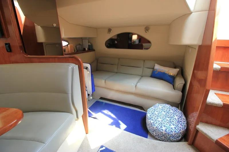 Slide: The Image of Interior of 2006 Cruisers Yachts 320 Express with cozy seating and elegant design. - 18