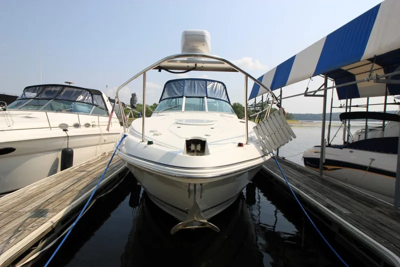 Slide: The Image of 2006 Cruisers Yachts 320 Express docked at marina, front view. - 1