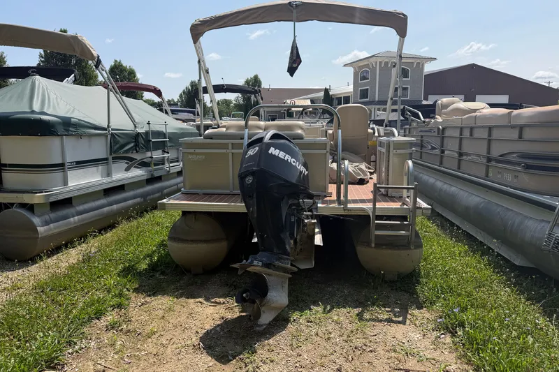 Slide: The Image of Pontoon boat with Mercury engine, Crest 230SLR Classic, 2012 model, parked on grass. - 13