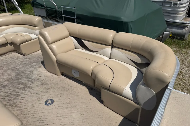 Slide: The Image of Beige seating on a 2012 Crest 230SLR Classic pontoon boat, featuring plush upholstery. - 3