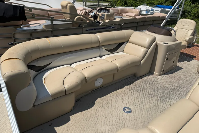 Slide: The Image of Beige seating on 2012 Crest 230SLR Classic pontoon boat, featuring spacious interior. - 5