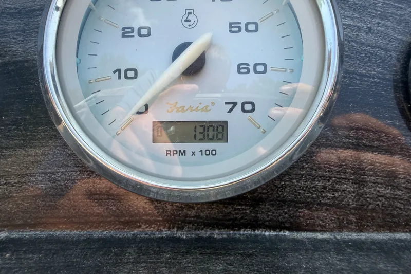 Slide: The Image of Close-up of a Faria tachometer showing 1308 RPM on a Crest 230SLR Classic, 2012 model. - 11