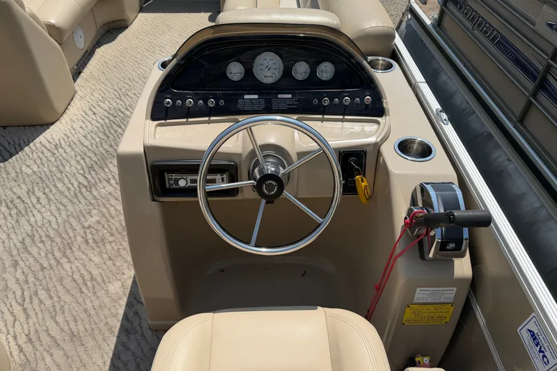 Slide: The Image of Steering console of a 2012 Crest 230SLR Classic boat with gauges and controls. - 8