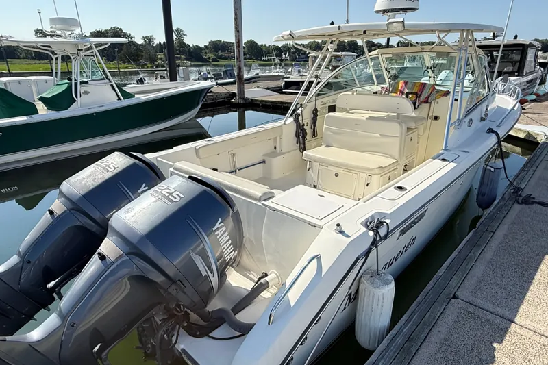 Slide: The Image of 2005 Pursuit 265 Denali LS boat docked with twin Yamaha 225 engines. - 4