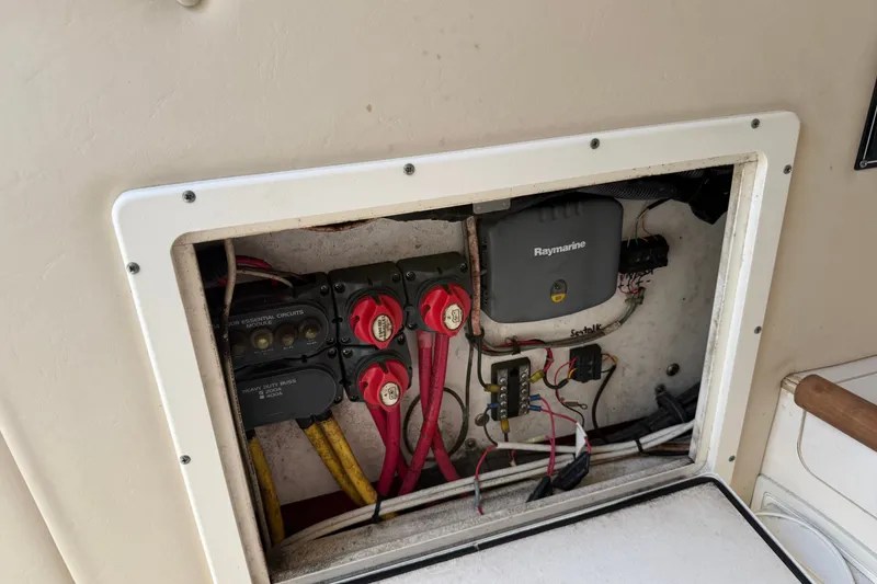 Slide: The Image of Electrical panel inside a 2005 Pursuit 265 Denali LS boat, featuring Raymarine equipment. - 9