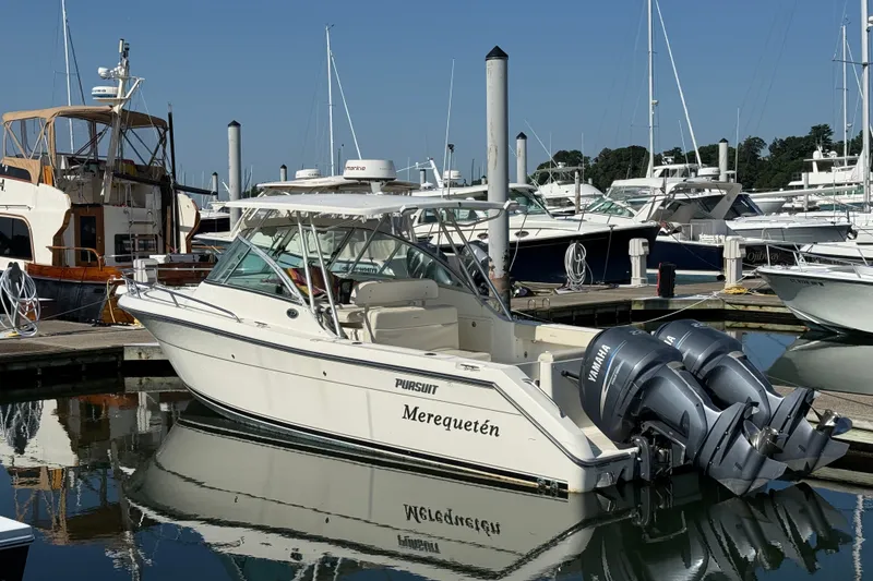 The Image of 2005 Pursuit 265 Denali LS boat docked in marina with twin Yamaha engines. - 0