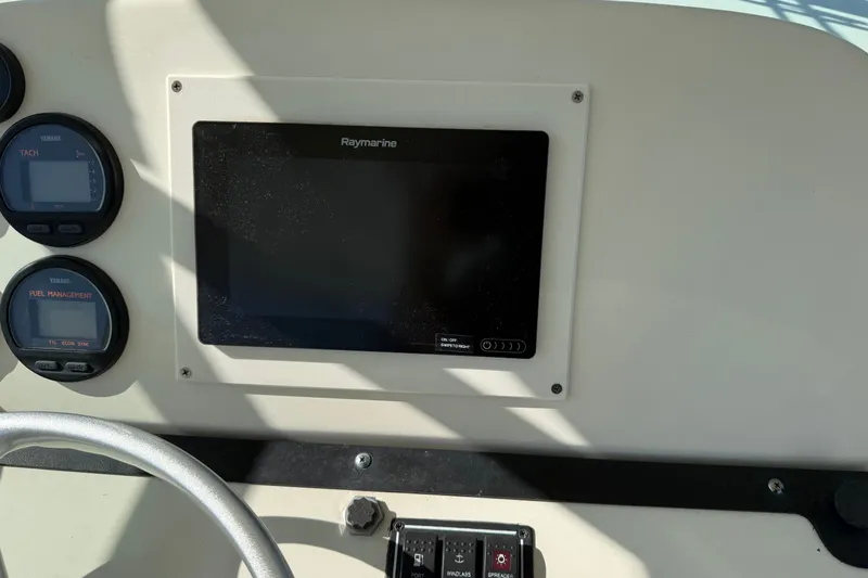 Slide: The Image of Dashboard of a 2005 Pursuit 265 Denali LS boat with Raymarine display. - 17