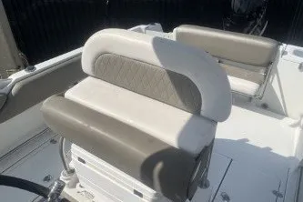 Slide: The Image of 2023 Crownline 220 CC Finseeker boat interior with cushioned seating. - 12