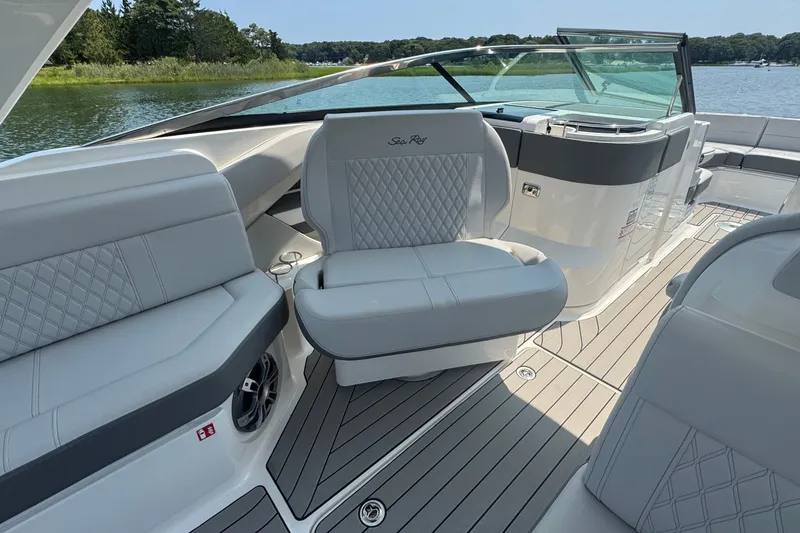 Slide: The Image of 2025 Sea Ray SLX 310 Outboard interior with luxurious seating and elegant design. - 33