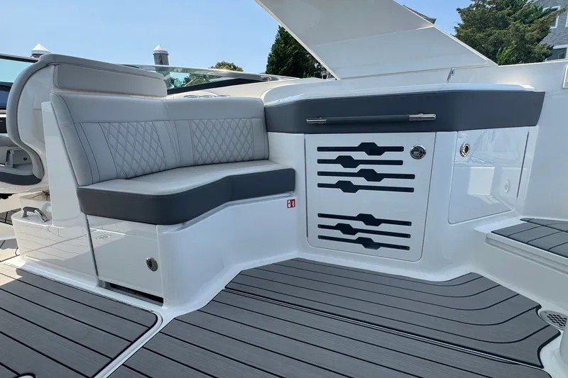 Slide: The Image of Luxurious seating area on 2025 Sea Ray SLX 310 Outboard boat, featuring sleek design and modern finishes. - 27