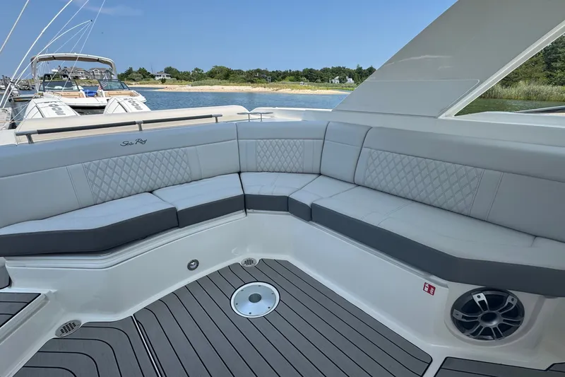 Slide: The Image of 2025 Sea Ray SLX 310 Outboard boat with luxurious seating and sleek design. - 24