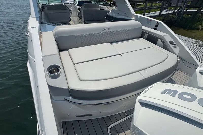 Slide: The Image of 2025 Sea Ray SLX 310 Outboard boat with luxurious seating and sleek design. - 19