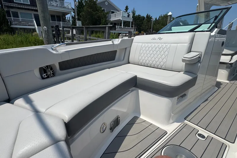 Slide: The Image of Luxurious seating on the 2025 Sea Ray SLX 310 Outboard boat, featuring elegant design and comfort. - 48